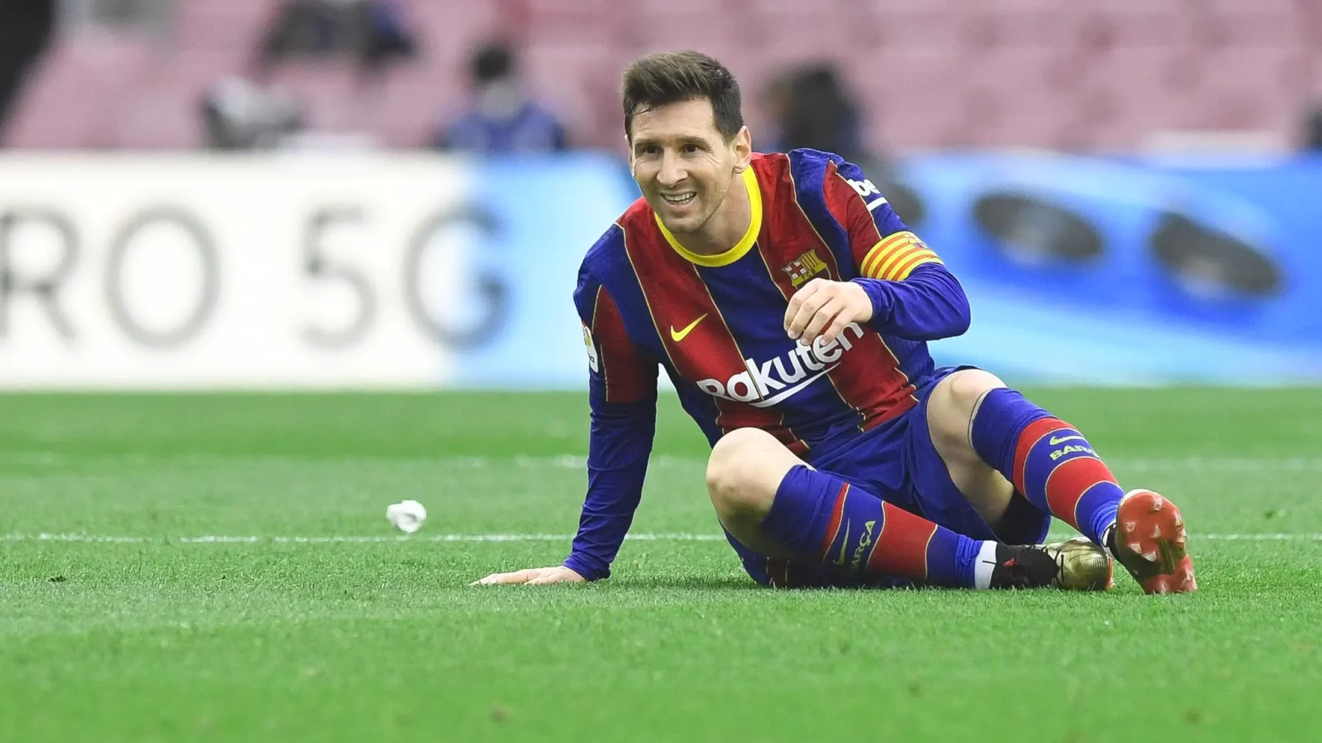 Messi sitting in football ground